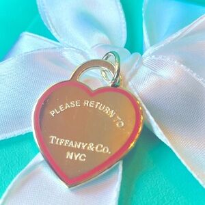 Tiffany & Co. New, Authentic, Sterling Silver Pink outlined Heart Charm.